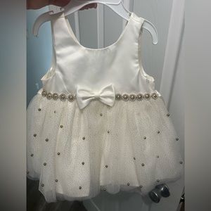 Baby girl off white, cream colored lace puff dress with gold beads.